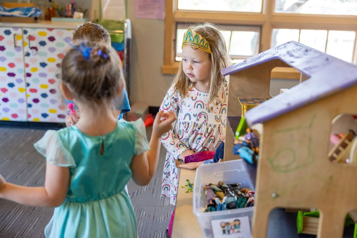 students at a doll house