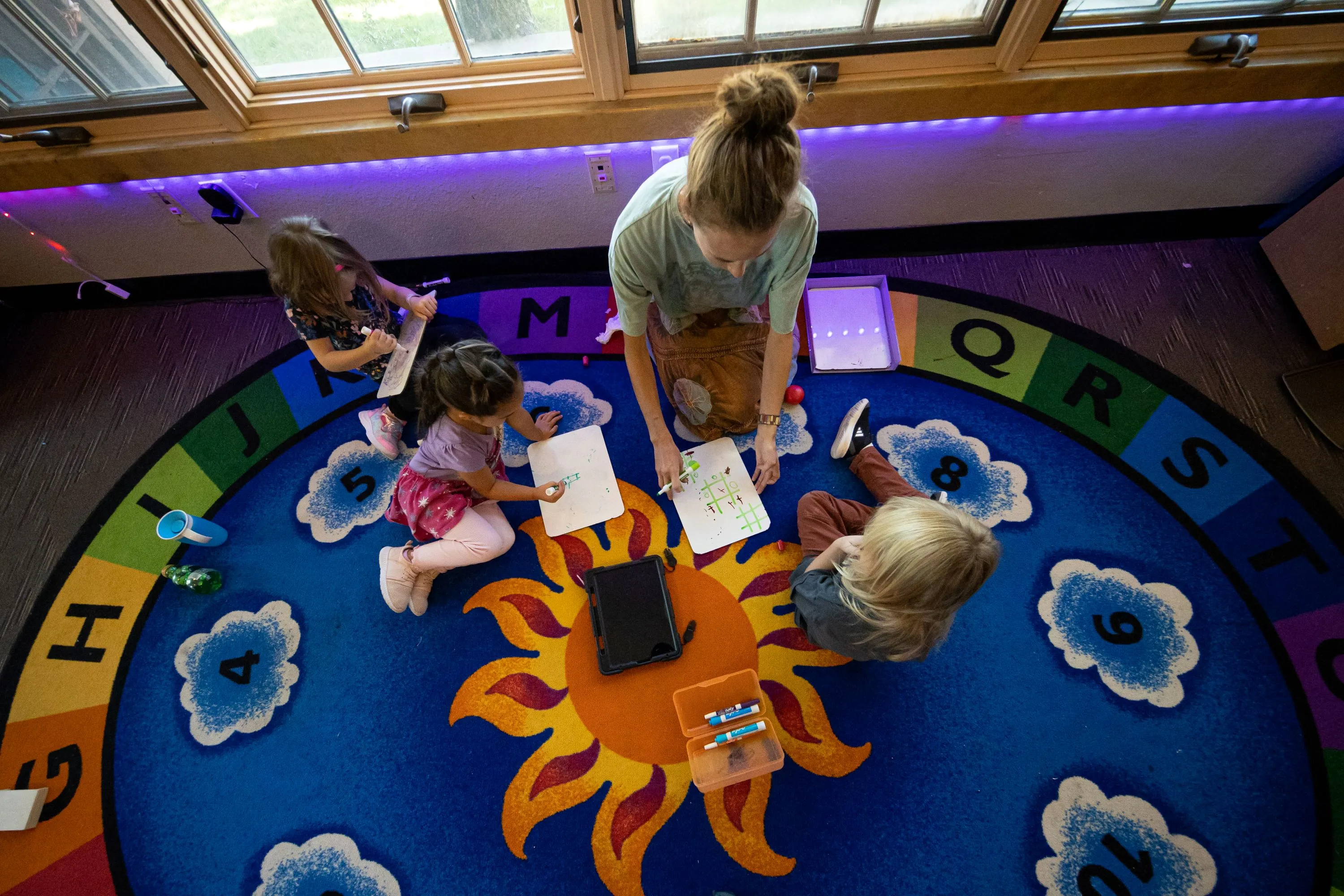 Looking down on a teacher and children learning