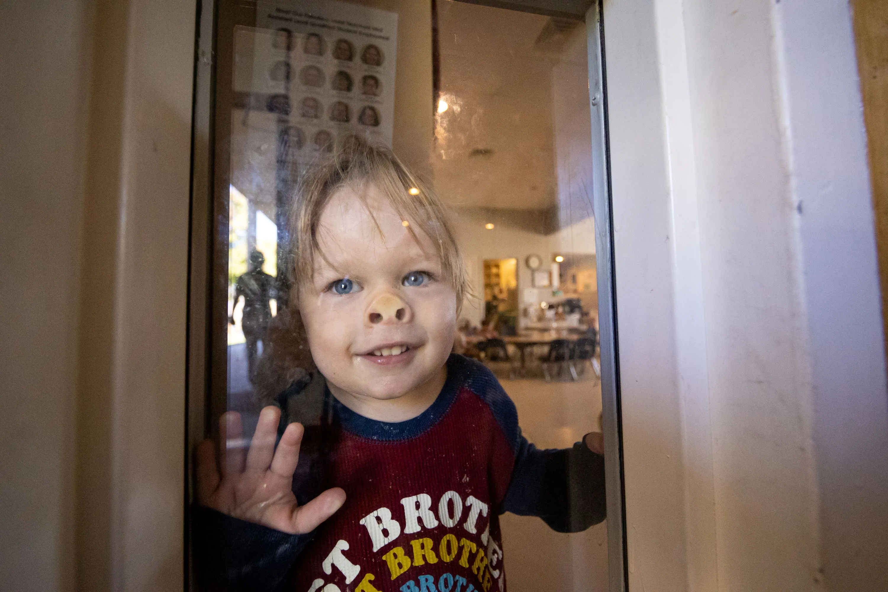 Child Pushing his face on the window