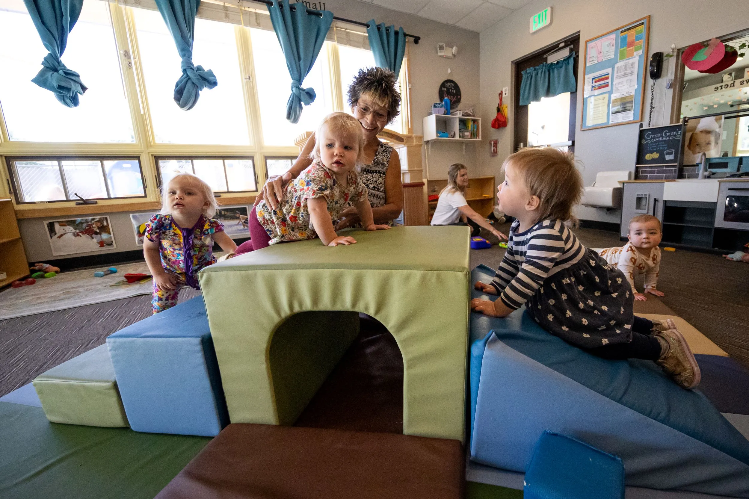 Teacher playing with toddlers